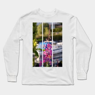 Wonderful landscapes in Norway. Blooming colorful lupine flower in Norway in the wild grass. Blur harbour background with boats. Summer sunny day (vertical) Long Sleeve T-Shirt